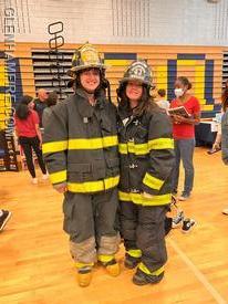 BHS Students trying on some gear.  Don't worry girls ... when you join, we'll get you something that fits better!